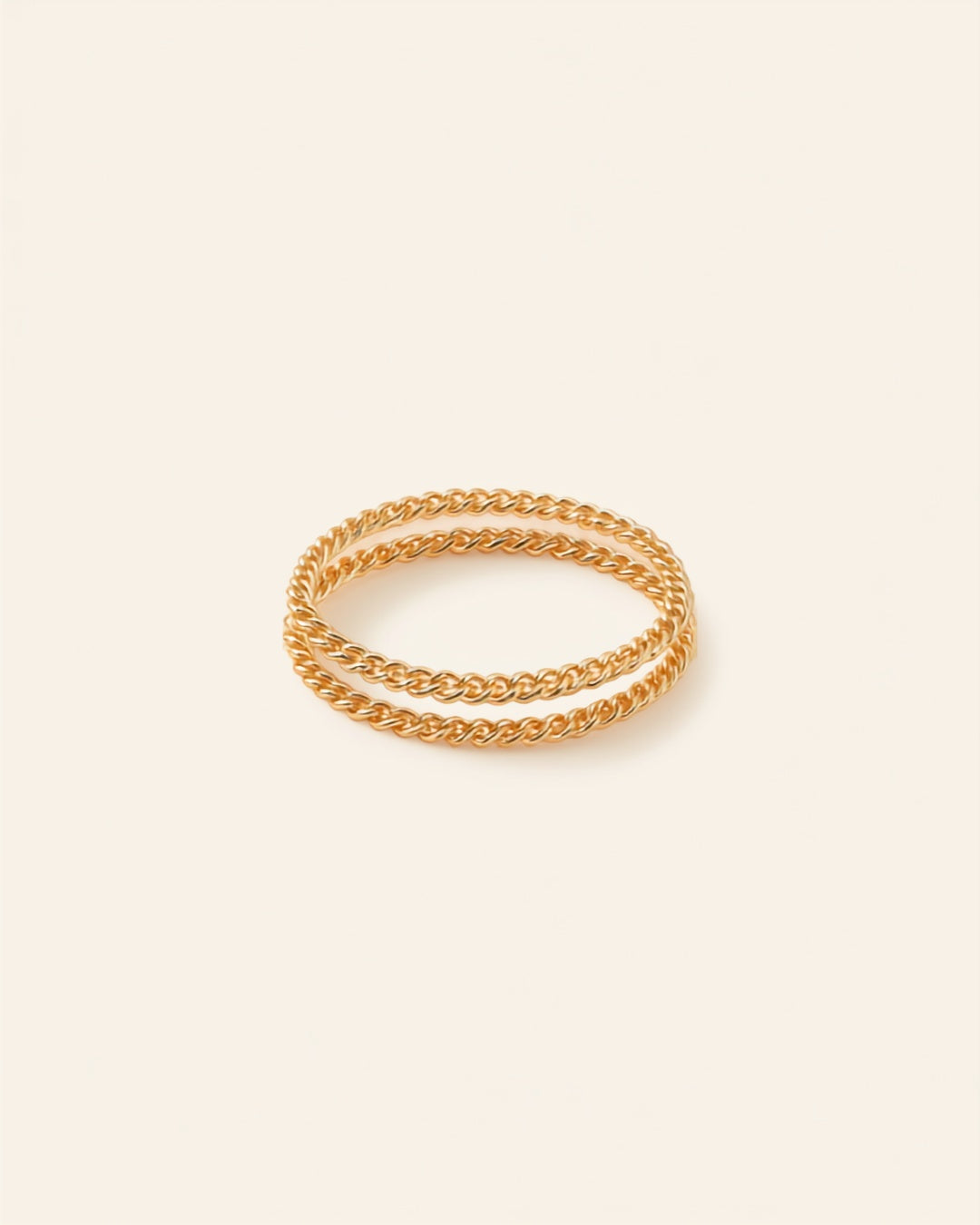 Gold chain bracelet set on cream background — Bare Gold waterproof jewelry