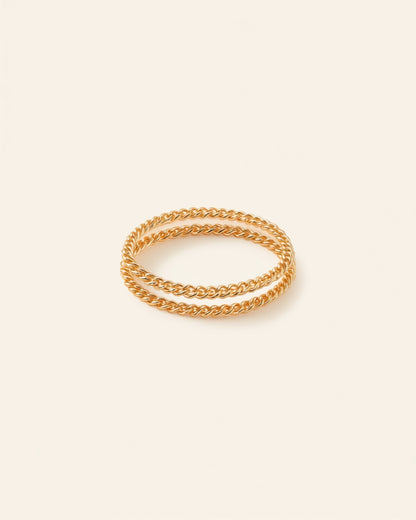 Gold chain bracelet set on cream background — Bare Gold waterproof jewelry