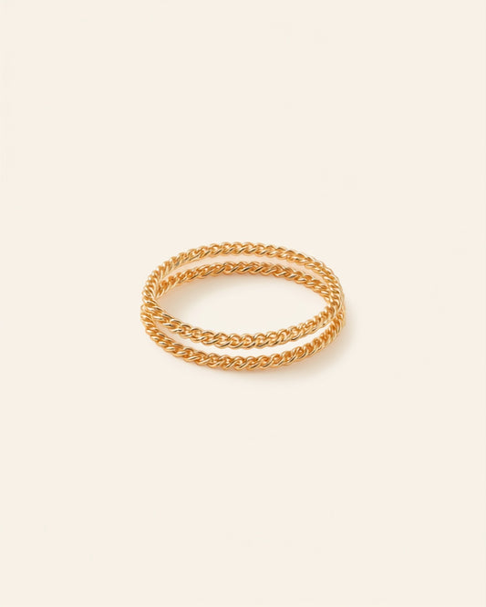 Gold chain bracelet set on cream background — Bare Gold waterproof jewelry